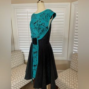 Handmade teal Wonder Woman print dress with flare. Vintage 1950’s swing look